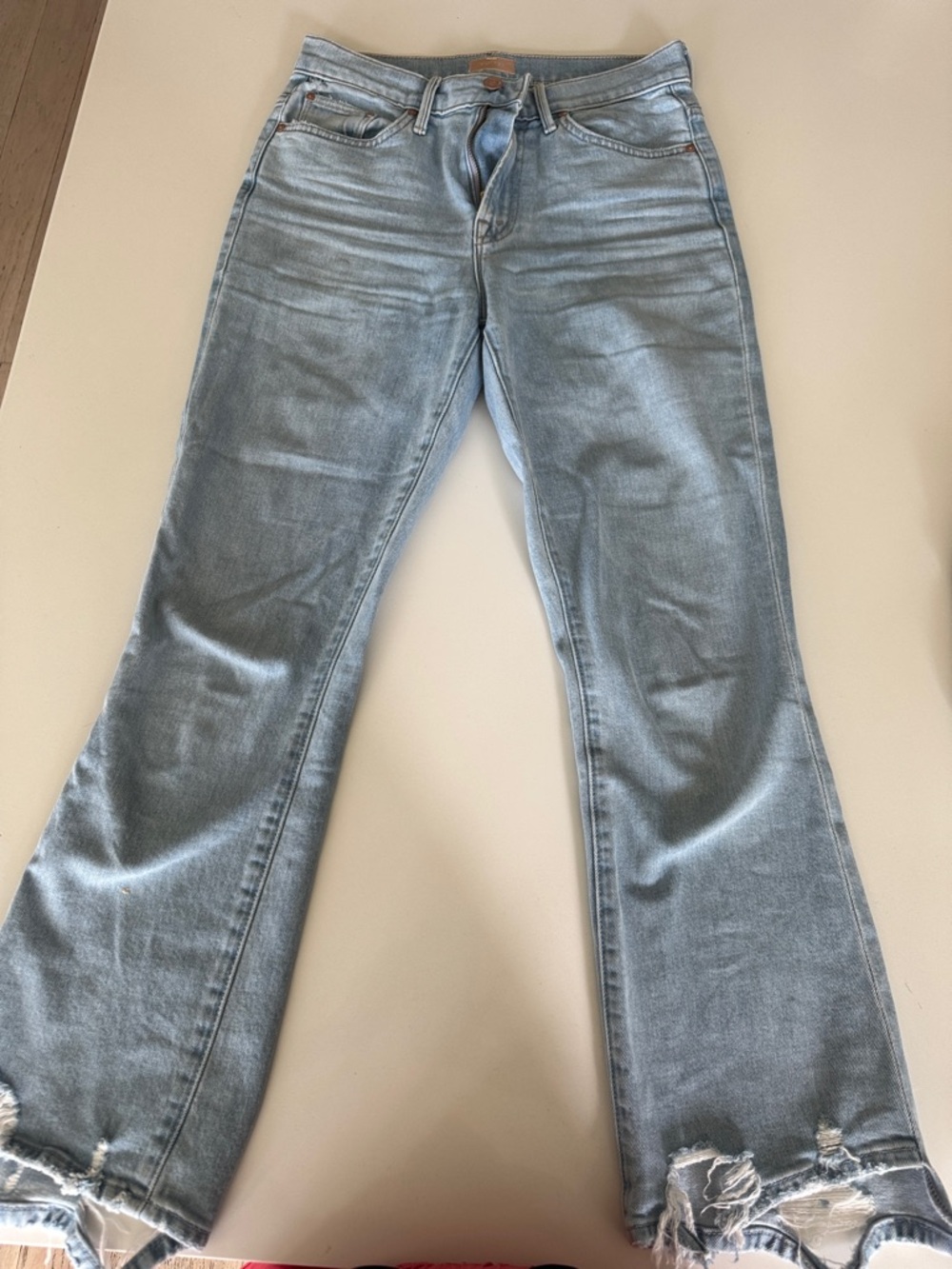MOTHER Light Blue Flare Jeans with Distressed Hem